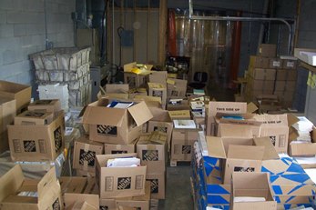 View of the same boxes, from the opposite side. The chair marks the “workplace” used for the job